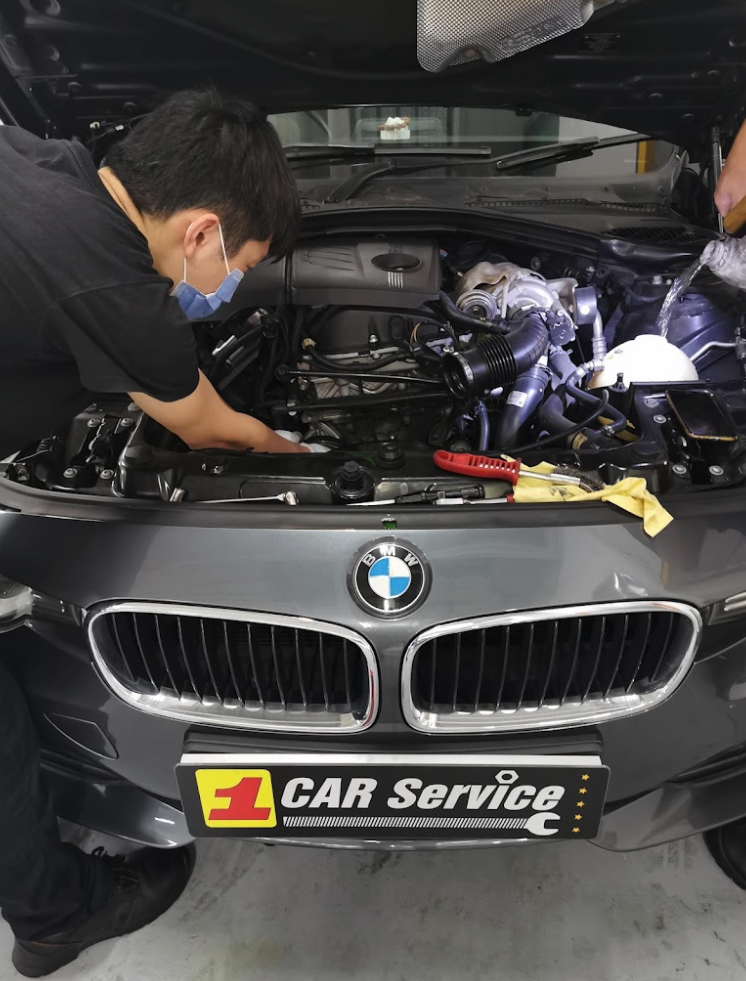 BMW undergoing engine oil change at the best BMW workshop in Singapore