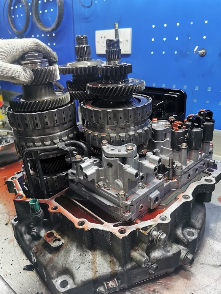 Gearbox technician performing the best gearbox overhaul in Singapore at 1 Car Service Workshop