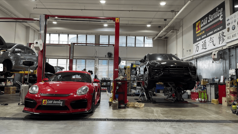 Front view of the best Porsche workshop in Singapore with certified technicians servicing a Porsche.