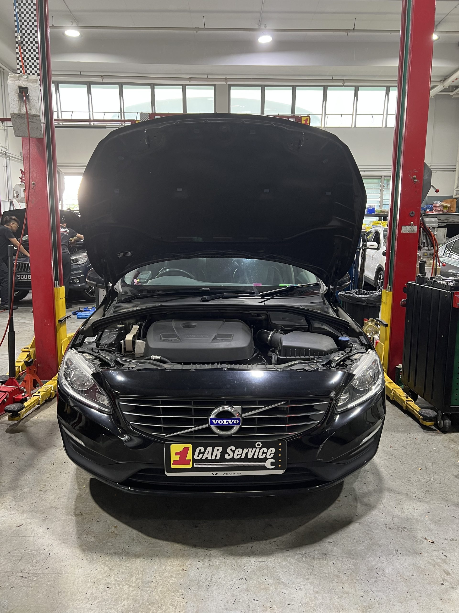 Pristine Volvo receiving a diagnostic check in a fully equipped Volvo workshop.