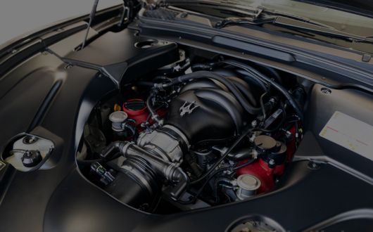 Maserati undergoing comprehensive servicing at a specialised Maserati workshop.